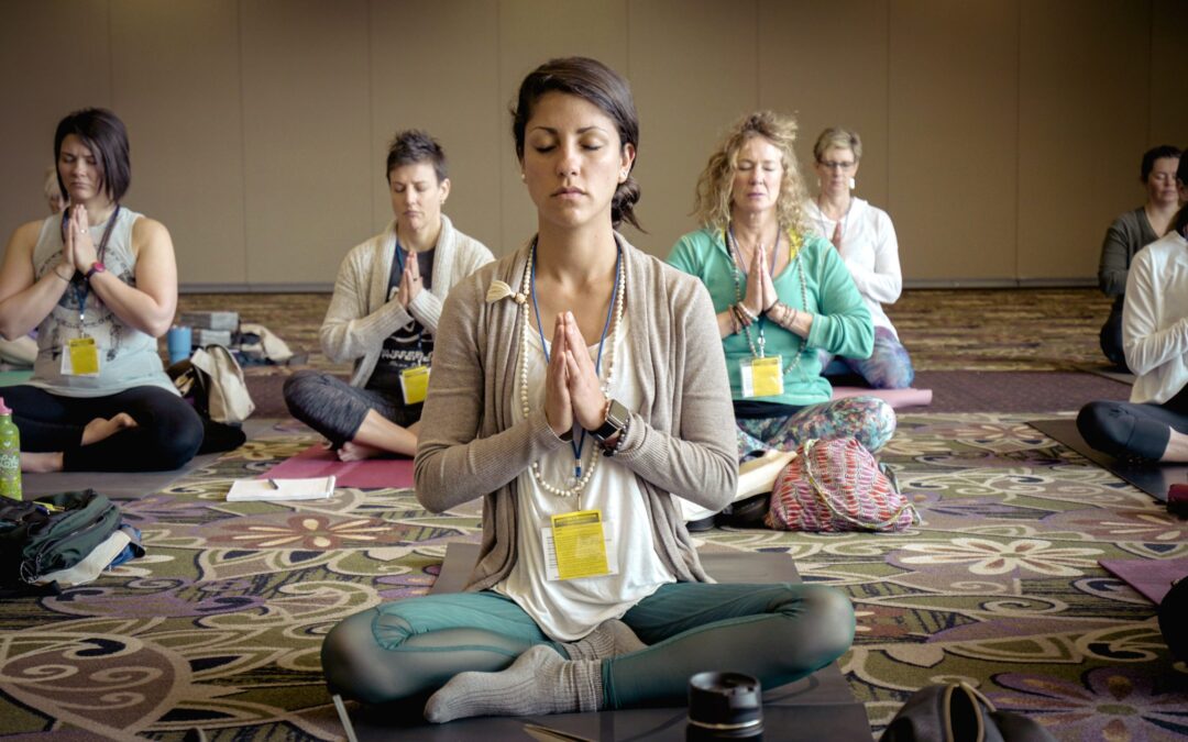 Group of people doing yoga and meditation