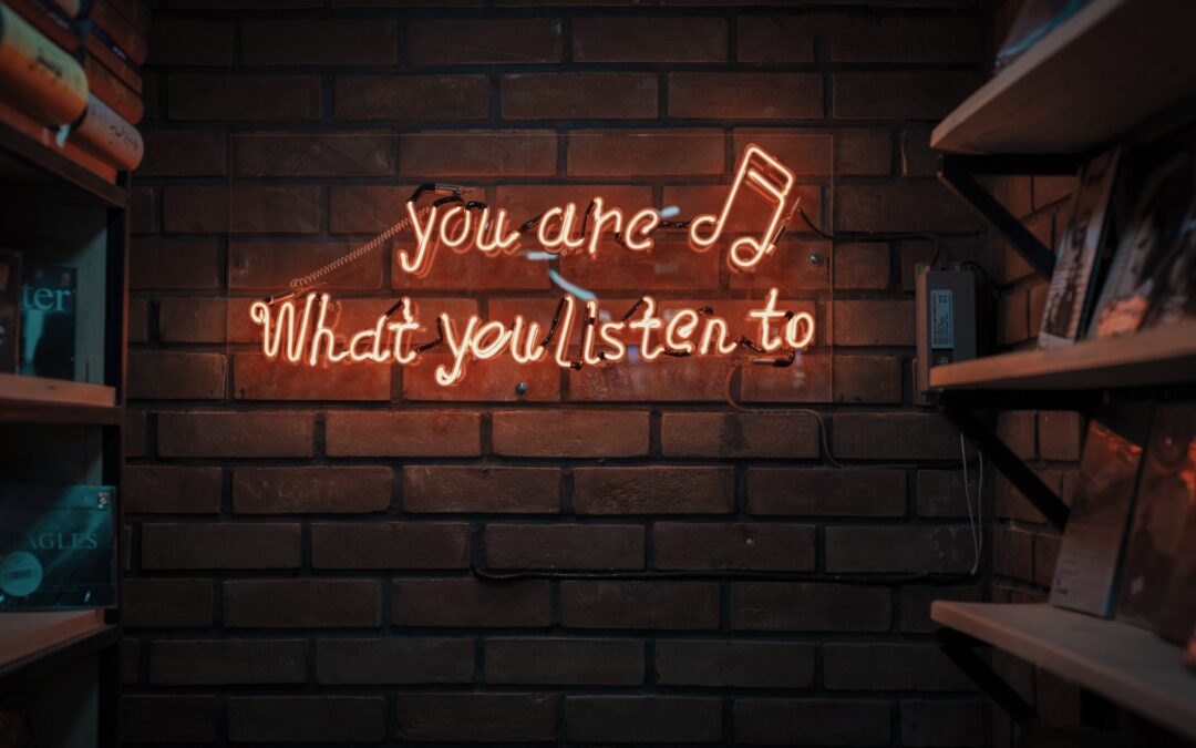 Neon sign reading"You are what you listen to"