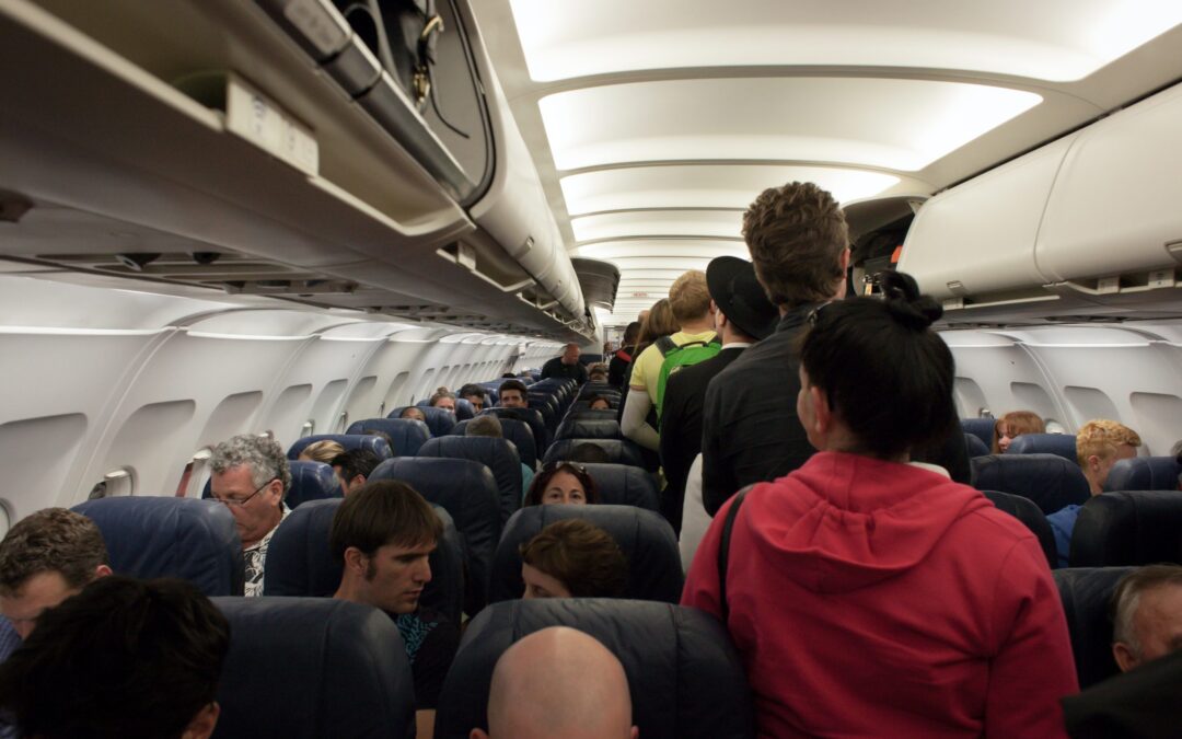 inside an aircraft where everyone is boarding