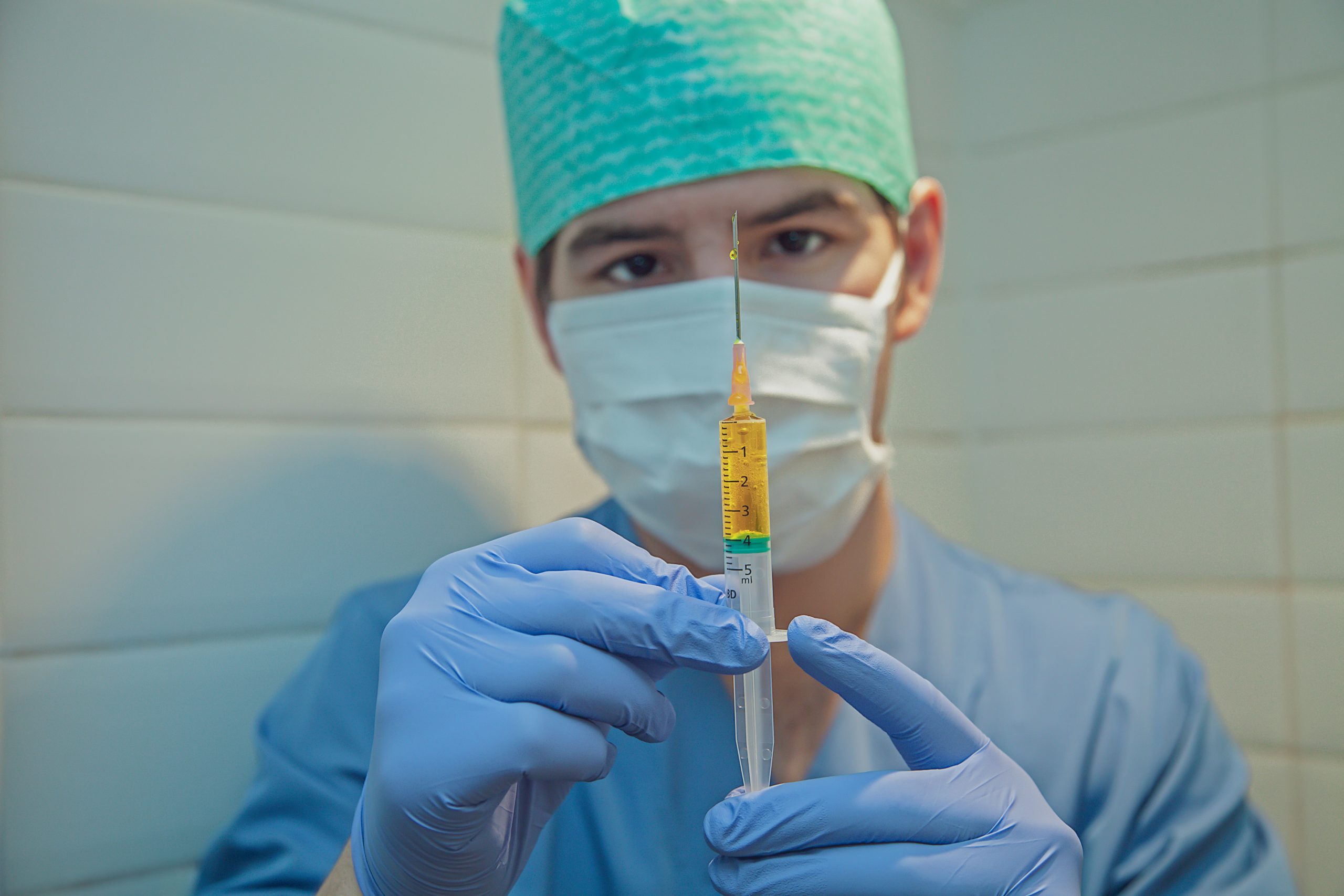 Person giving COVID Vaccine