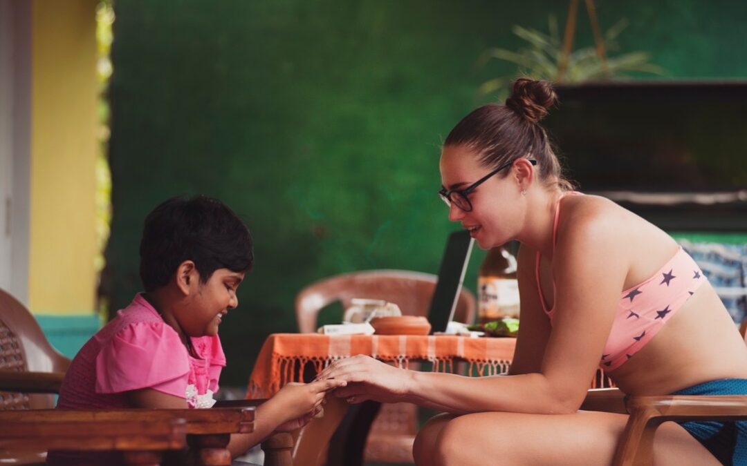 A boy and a woman sitting in the foreground