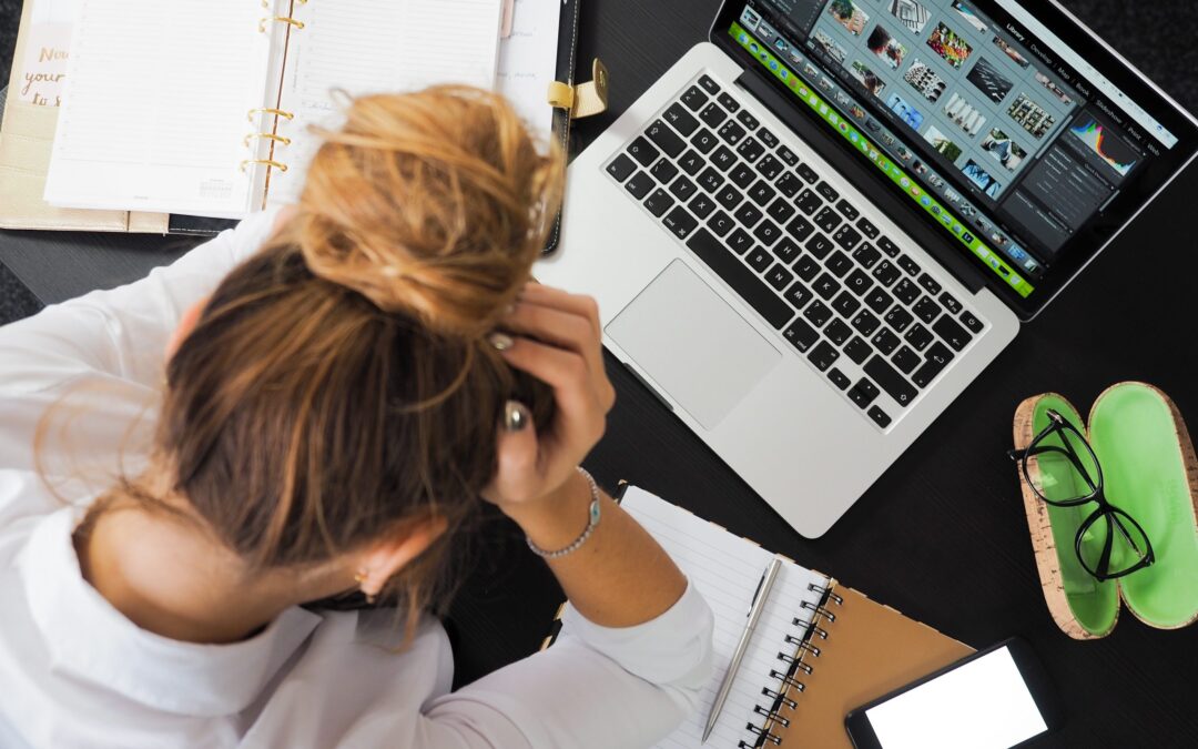 Woman Sitting in Front of Macbook