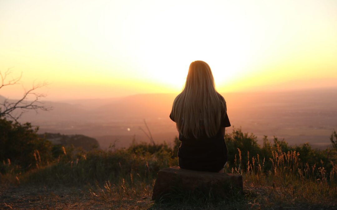 a person watching sunset and thinking about unipolar and bipolar depression.