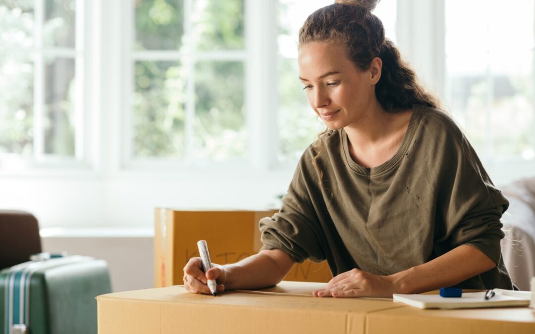 Pleasant woman preparing stuff for moving