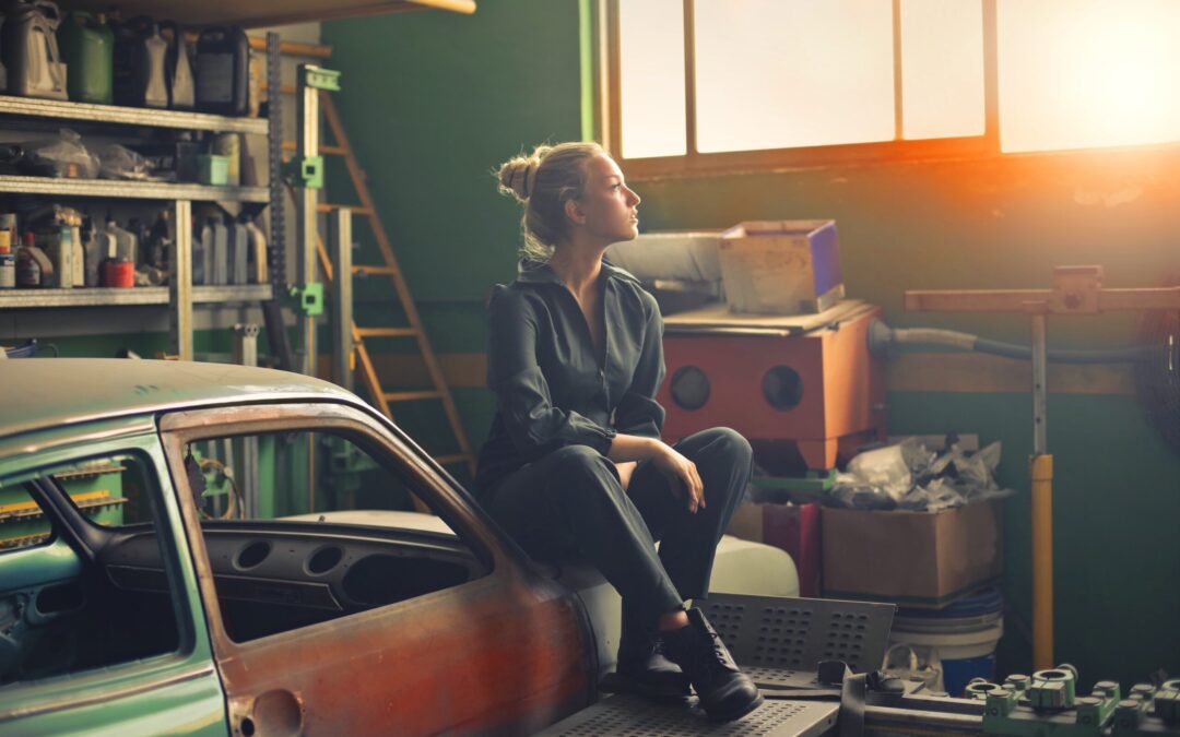 Woman in garage staring out window