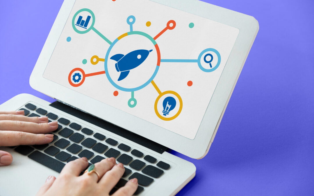 laptop showing rocket graphic that leads off to other concepts like idea, bar charts, settings and magnifier search logo